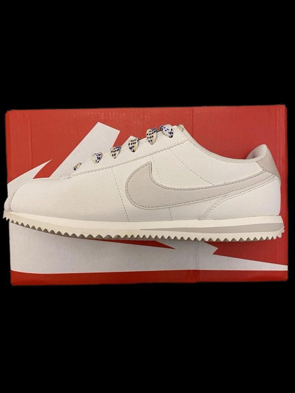 Woman’s White Nike Cortez